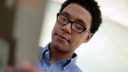 Hip young businessman studies company brochure Stock Footage