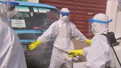 Workers preparing to bury Ebola victims News Clip