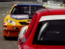 TS CU TU ZI Two racecars competing for first position along racetrack / Long Pond, Pennsylvania, USA Stock Footage