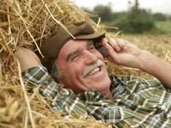 HD: Farmer With A Mobile Phone Stock Footage