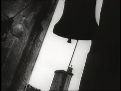 A church bell rings in a belfry. News Clip