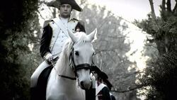 Soldiers in French Revolution uniforms march behind a white horse with a mounted military officer. Stock Footage
