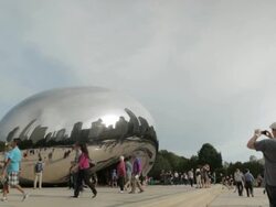 Tourists walk around the Bean in Chicago Stock Footage