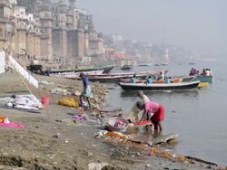WS View of Men washing clothes at River Ganges / Varanasi, Utter Pradesh, India  Stock Footage