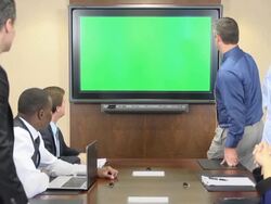 Business Professionals in Front of Chroma Key Monitor Stock Footage