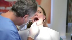 Young woman getting dental exam Stock Footage