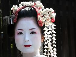 Beautiful Japanese Geisha girl enjoying having her Photograph taken, Japan, Asia Stock Footage