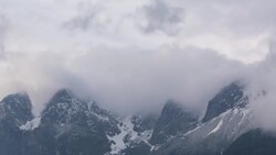 turbulent clouds covering alps peaks Stock Footage