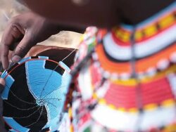 Samburu woman threading beads Stock Footage