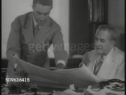 1939: PANAMA CANAL: Panama Zone Governor Clarence S. Ridley (1883-1969) in meeting, looking over papers w/ others. US Navy soldiers patrolling in group. HA WS Battleship moving in lock. US Soldiers standing guard in Miraflores lock building. Instructional Video