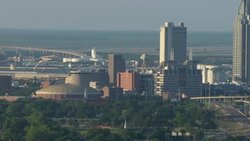 Aerial of Mobile Civic Center zooming out to reveal skyscrapers. Stock Footage