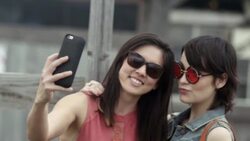 Two young women take smartphone selfie in Texas ghost town Stock Footage