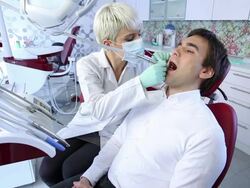 Young man in dentist office Stock Footage