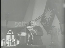 1945: CHINA CIVIL WAR: ** VS General Chiang Kai-shek in shrine-like building speaking, reading (no SOT). MS Chinese official at desk signing papers w/ Chinese mediator & General George Marshall overlooking from behind. Ceasefire Instructional Video