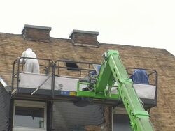 MS Housebreakers removing asphalt roof / Saarburg, Rhineland-Palatinate, Germany Stock Footage