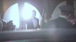 Hollywood couple leaving theater wave to fans on red carpet at awards show Stock Footage