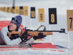 MS PAN woman rifle shooting in sunny winter day / Whistler ,BC ,Canada Stock Footage