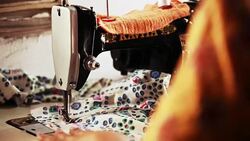 Female tailors working on sewing machine Stock Footage