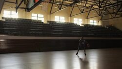 A basketball player dribbles and dunks in an empty basketball gym. Stock Footage