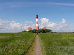 EWS View through walking trails of Westerhever lighthouse, North Frisian Wadden Sea / Westerhever, Schleswig Holstein, Germany Stock Footage