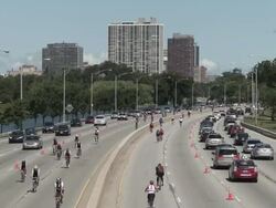 WS Cyclists on highway / Chicago, Illinois, USA Stock Footage