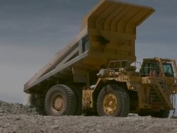 MS Shot of construction vehicle dumping its load / Namibia Stock Footage