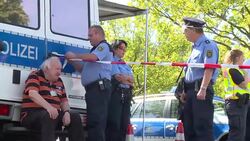 CLEAN : Police, media wait at refugee centre ahead of Merkel visit News Clip