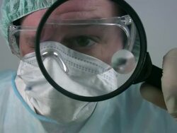 Medical scientist \scrutiny using magnifier\ Stock Footage