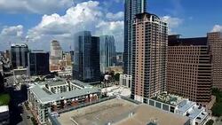 Rising Up above Austin Texas Downtown Skyline Cityscape Frost Bank tower View Stock Footage