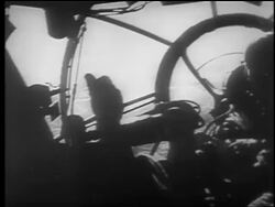 B/W 1940 over-the-shoulder point of view from cockpit of bomber / London Blitz / educational Stock Footage