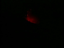 MS glowing orange lava on mountainside, night, Mount Tunguragua, Ecuador Stock Footage
