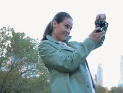 MS View of women using digital camera in Central Park during autumn / New York City, New York, USA. Stock Footage