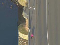 WS TD AERIAL View of people walking on roman oldest bridge / Trier, Rhineland Palatinate Stock Footage