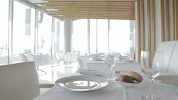 Place settings on tables in empty restaurant Stock Footage