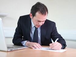 Male lawyer writing report Stock Footage