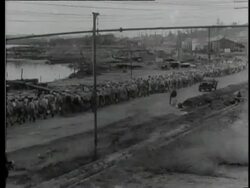 A group of 3500 Japanese prisoners of war leaves Borneo with an American ship Stock Footage