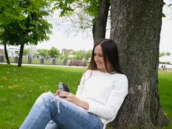 woman taking selfie in the park Stock Footage