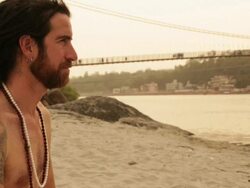 Sage sitting at ganges riverbank, Laxman Jhula, Rishikesh, Uttarakhand, India Stock Footage
