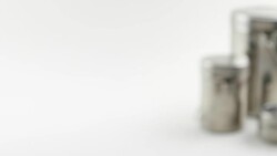 Pan left to Set of Indian kitchen utensils in stainless steel in white isolated background Stock Footage