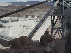 Dolly shot of sunny Hoover Dam Stock Footage