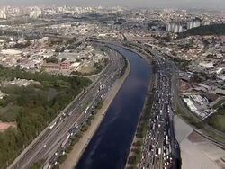 Aerial View of SÃƒÂ£o Paulo 'Marginal TietÃƒÂª' river with heavy traffic Stock Footage