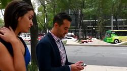 MS TS Couple in discussion while walking on sidewalk in city Stock Footage