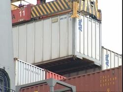 APL container being lifted from stack, Container Terminal, Southampton, UK Stock Footage