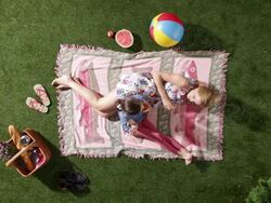 MS, Lockdown, mother and daughter relaxing on a blanket, eating apples, overhead view Stock Footage