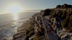 Fly by cliff runners Bondi to Bronte Stock Footage