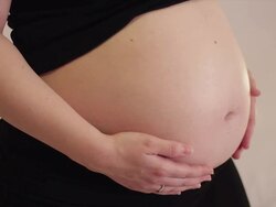 Pregnant woman caressing her belly Stock Footage
