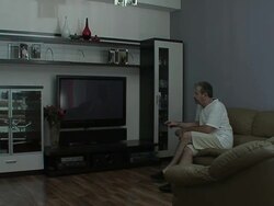 Man watches TV Stock Footage
