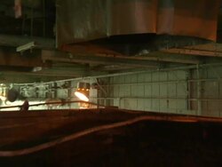 Dirt falls out of a chute into a garbage bin. Stock Footage