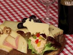 CU Cheese plate with Bavarian cheese varieties and walnut / Lenggries, Bavaria, Germany Stock Footage