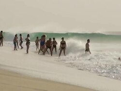 MS View of People enjoying in big waves on beach near Santa Maria / Santa Maria, Sal, Cape Verde Stock Footage